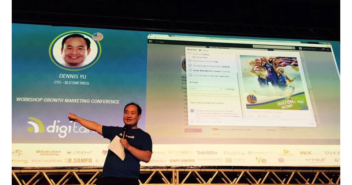 Dennis Yu presenting on stage at a Digitalks growth marketing conference