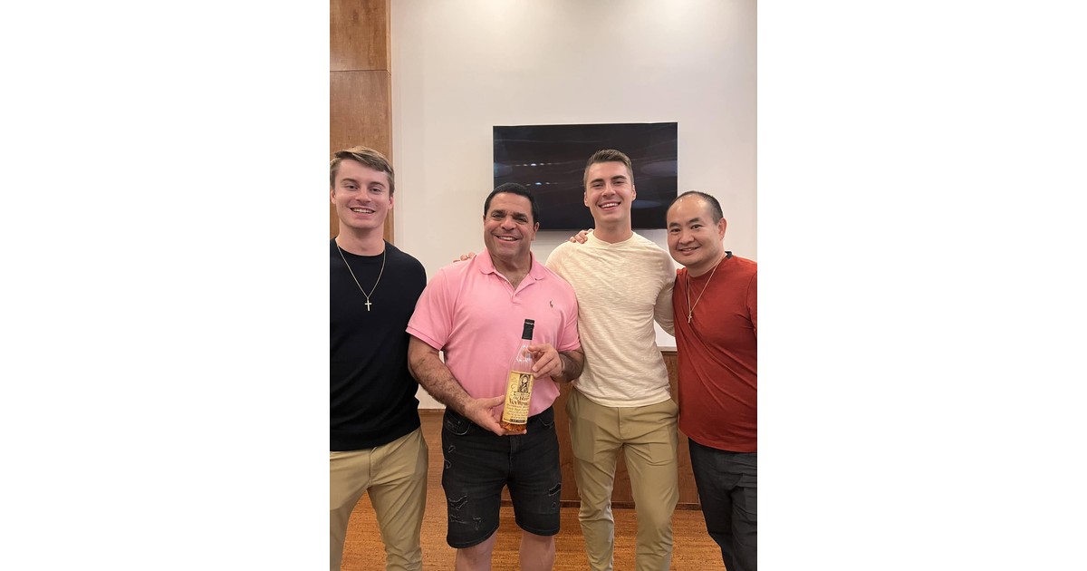 Dennis Yu with attorney Darryl Isaacs and two young entrepreneurs at an event